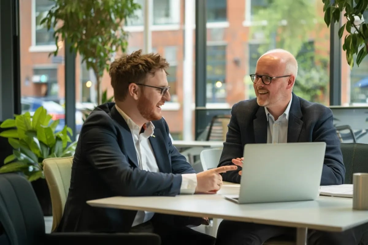 050525_Carbon Credit Funds in Your IRA_A Carbon credit funds representative discussing investment opportunities with a businessman_visual 2